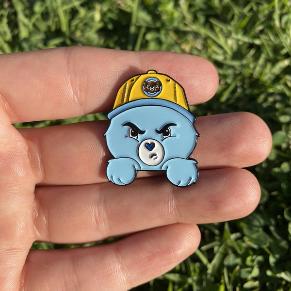 Custom diecut soft enamel lapel pin with green and blue enamel and silver metal plating