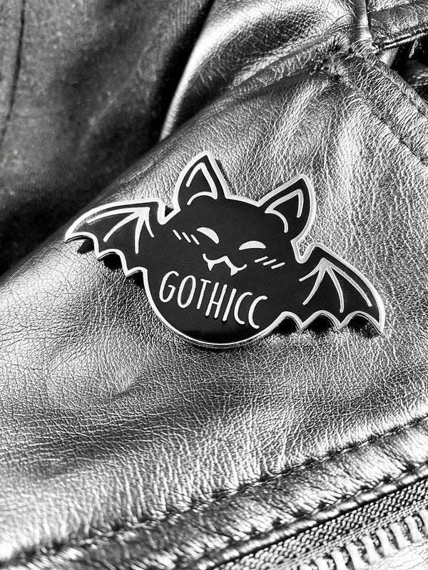 Custom pin with gold metal and hard enamel coloring all on a diecut shape