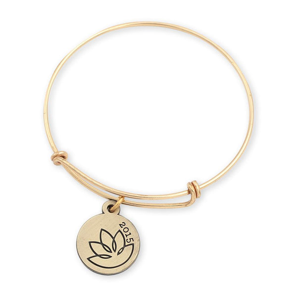 Lotus charm bracelet with custom charm and shiny gold bangle bracelet for jewelry quality look